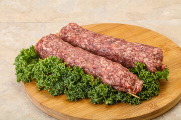 Raw minced beef kebab skewer