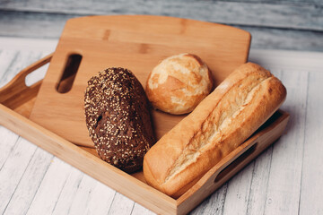 whole grain bread loaves homemade cakes cooking wood board close-up
