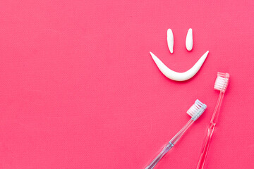 Teeth hygiene concept. Toothbrushes with toothpaste, top view