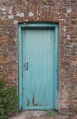 old blue door in wall