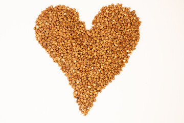 handmade heart heart icon march 8 cereal heart . A pile seeds forming a heart on a white background