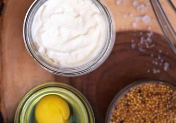 Homemade mayonnaise. Ingredients for mayonnaise oil, egg, and mustard