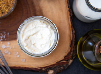 Vegetarian mayonnaise. Ingredients for mayonnaise oil, milk and mustard. Homemade mayonnaise