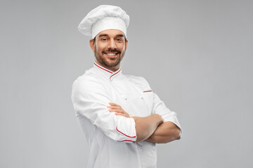 cooking, culinary and people concept - happy smiling male chef in toque and jacket over grey background - obrazy, fototapety, plakaty