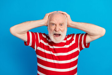 Photo of angry old grey hairdo man hand head wear red t-shirt isolated on bright blue color...
