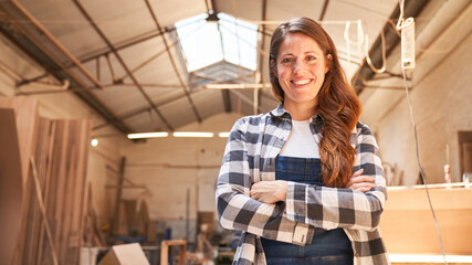 Young woman as a self-confident carpenter apprentice