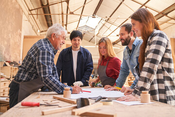 Craftsmen team working together in workshop