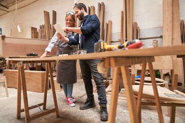 Craftsman trainer and woman as an apprentice