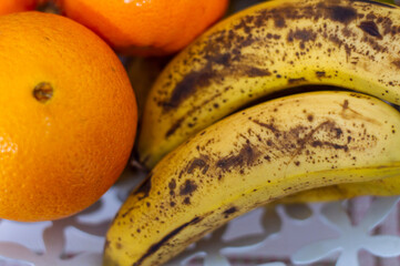 Still life of seasonal fruit with oranges, tangerines, bananas, pears and kiwis. Fruit of the Mediterranean coast.