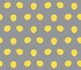 Colors of year 2021 illuminating yellow and ultimate gray easter egg polka dot pattern. Flat yellow Easter egg seamless vector pattern on gray background. Simple vector illustration