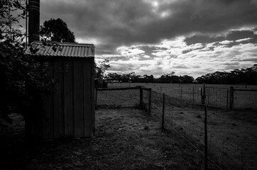 Black and white photo of an old shed