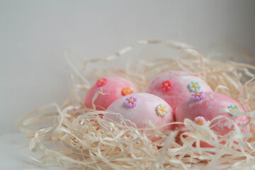 easter eggs in a nest. pink eggs. Easter. eggs on white background.
