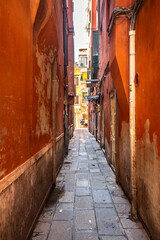 Obraz na płótnie Canvas Old historic buildings along a narrow street. Venice, Italy