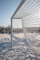 football field in winter frozen net