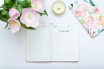To do list, flowers, notebook on white background