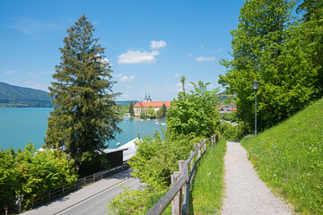 view from panorama path to Tegernsee lake and castle, tourist destination bavaria