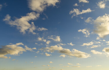 Sunset in blue sky with clouds