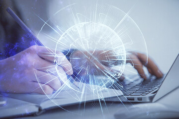 Multi exposure of woman hands typing on computer and business theme hologram drawing. Success...