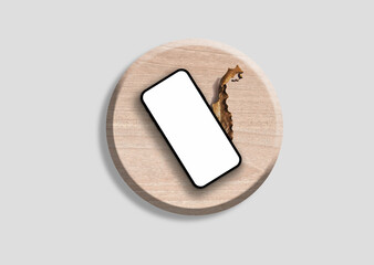 empty phone screen mockup on the wooden table with a dry leaf