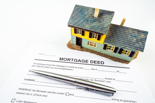 Mortgage Deed Letter Form And Model House And Pen For Props.