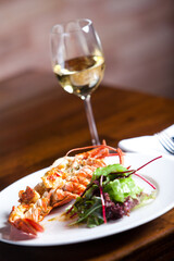 Grilled shrimps and white wine in restaurant