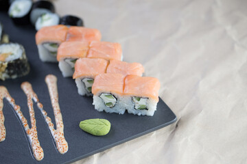 Different types of sushi and rolls in restaurant