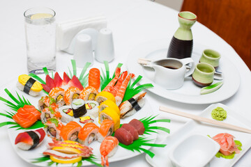 Different types of sushi and rolls in restaurant