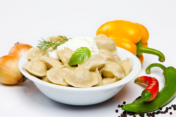 Cooked dumplins Ravioli and paprika