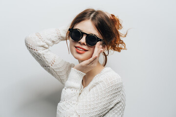 red-haired woman wearing glasses white sweater cropped view