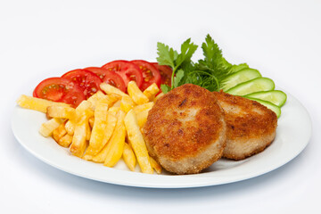 Cutlet and french fries on white plate