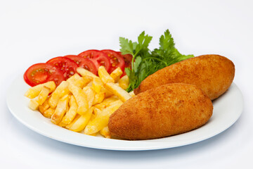 Cutlet and french fries on white plate