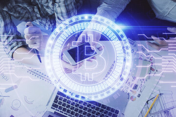 Double exposure of crypto theme drawing and man and woman working together holding and using a mobile device. Blockchain concept.