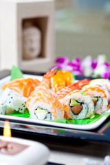 Different types of sushi and rolls in restaurant