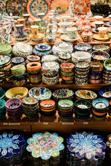 Fototapeta na wymiar Vertical photo of handicraft pottery at a market