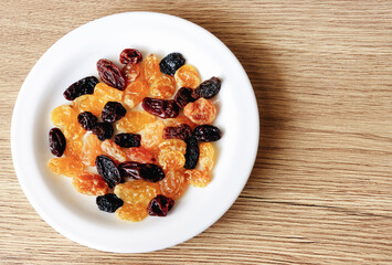 Dried raisins in a plate on the table