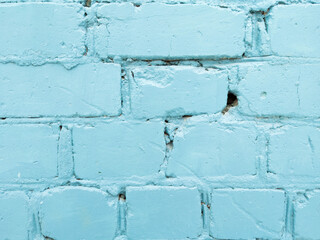 A blue brick wall. The brick wall painted in blue.