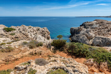 Fototapeta na wymiar Path to the beach in Mediterranean sea cliffs coast in Cyprus.