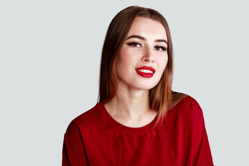 Beautiful face of young adult woman with nose earring and clean fresh skin. Portrait of cute...