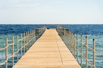 Obraz premium Empty wooden pier over the sea at summer