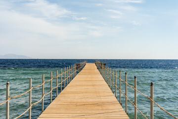 Empty wooden pier over the sea at summer