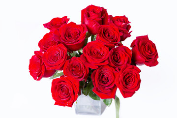 Obraz premium Bouquet of red (burgundy) roses on a white background. Water drops. Close-up.