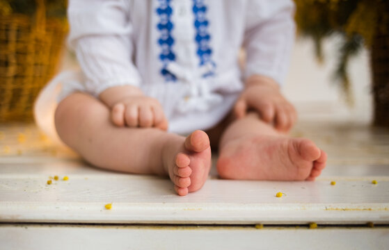 Baby Baby's Feet Close Up On White Background