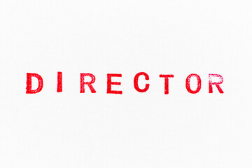 Red color director word ink rubber stamp on white paper background