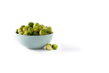 Set of brussel sprouts in a bowl isolated on white background.Copy space