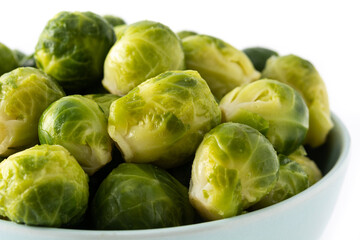 Set of brussel sprouts in a bowl isolated on white background