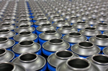 Aerosol cans awaiting production filling process in factory