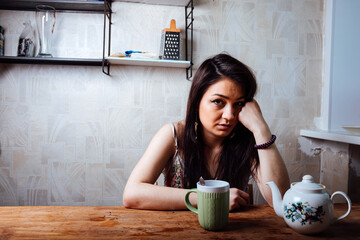 a girl with a smile drinks coffee for breakfast