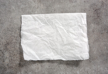 White paper napkin on grey stone table top view,food advertisement element,empty space blank.Baking...