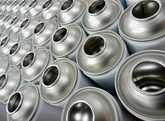 Aerosol cans awaiting production filling process in factory