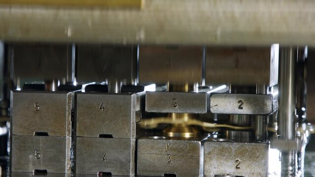 A large industrial punch press forming sheet metal parts